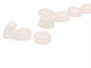 Three pierced rose quartz discs