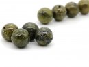 Four green serpentine balls