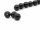 Three black pierced tourmaline beads