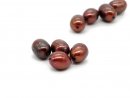 Four red oval cultured pearls