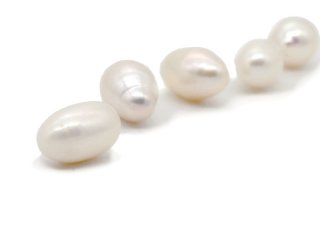 A pierced, white cultured pearl