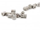 Ten silver coloured jewellery beads