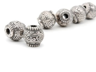 Two decorated silver beads