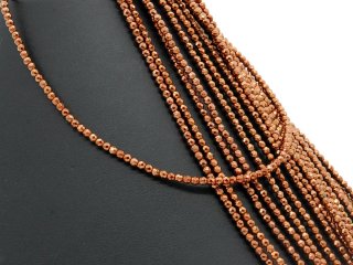 Petites boules dhématite percées et facettées de couleur brune