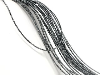 Shiny, pierced spheres made of hematite in grey