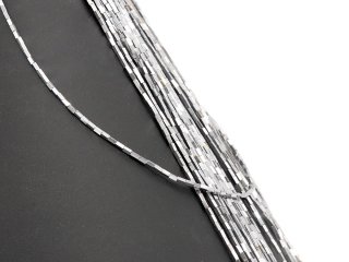 Shiny, pierced hematite rollers in grey