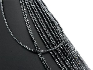 Pierced, faceted, grey hematite wagon wheels