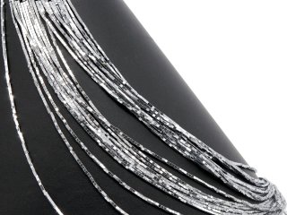Shiny, pierced hematite cubes in grey
