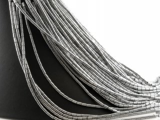 Pierced hematite rollers in grey