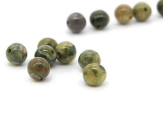 Seven small rhyolite beads